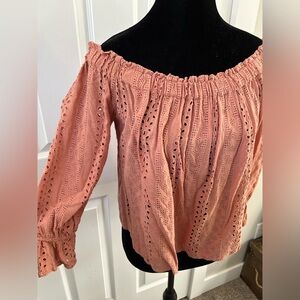 Woman’s eyelet off the shoulder top.